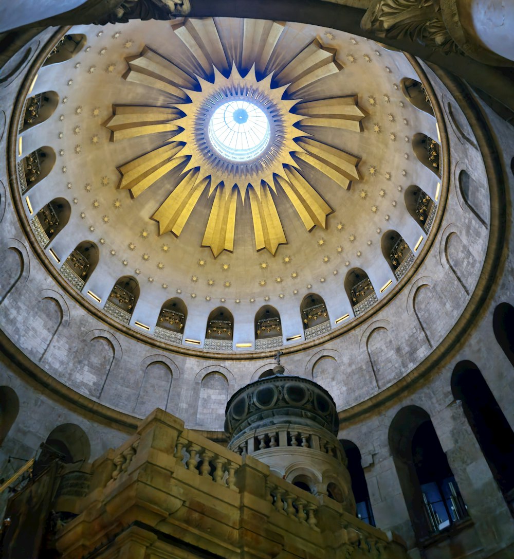 the ceiling of a large building with a dome