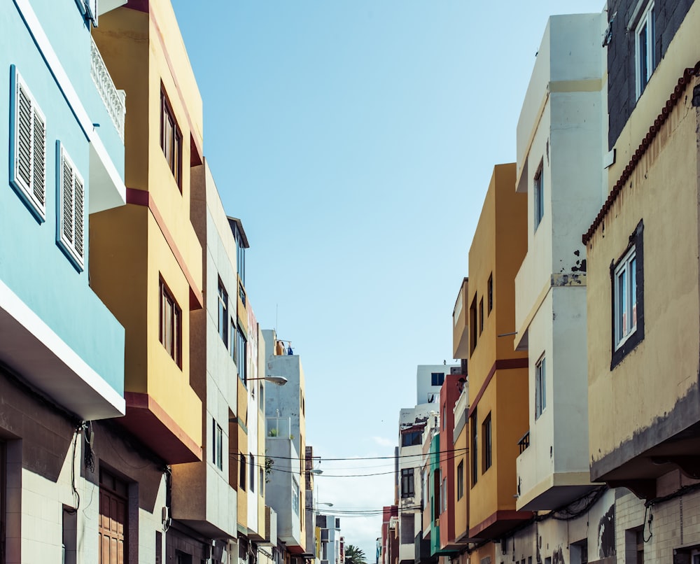 a narrow city street lined with tall buildings