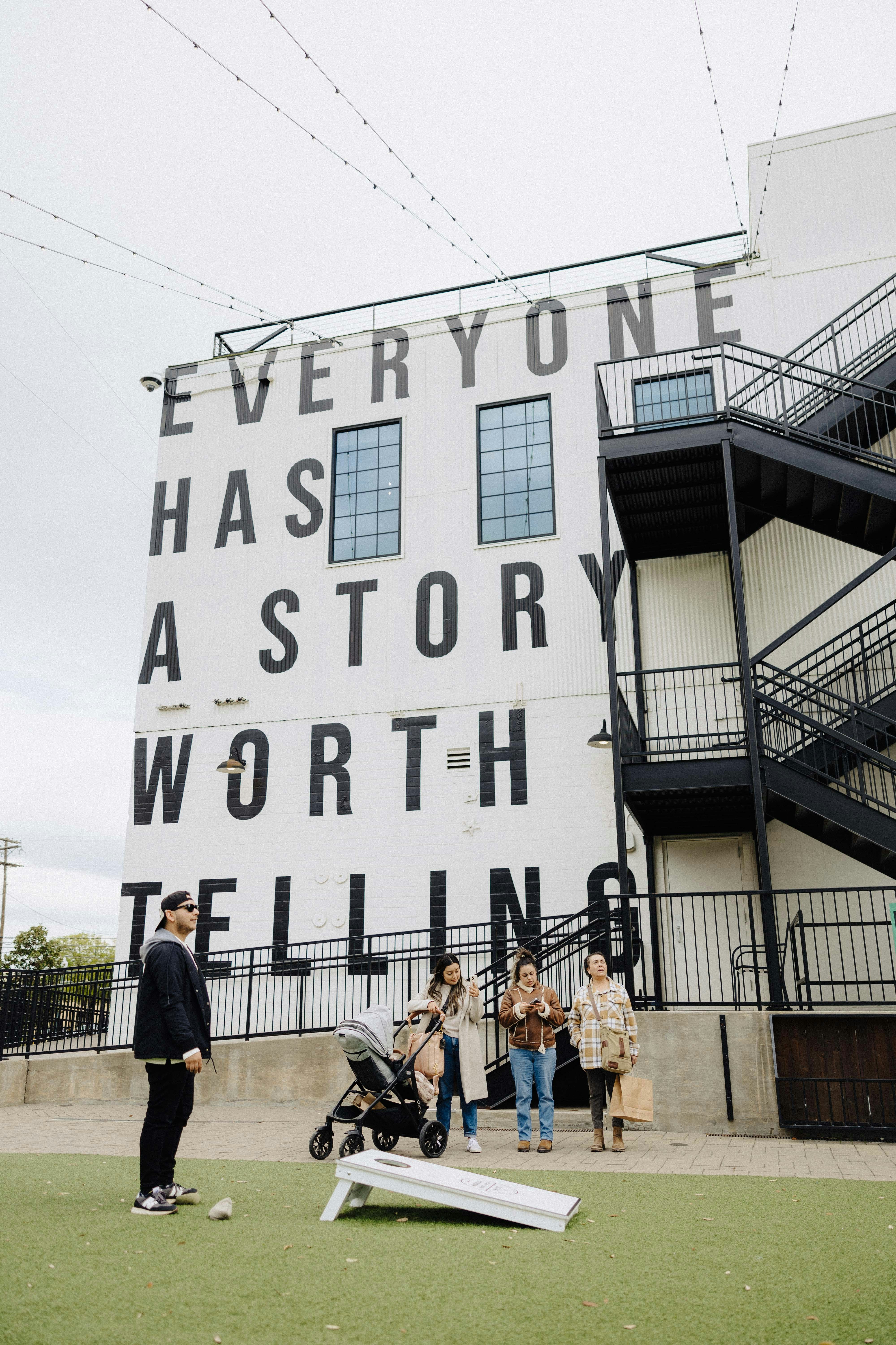 a group of people standing in front of a building