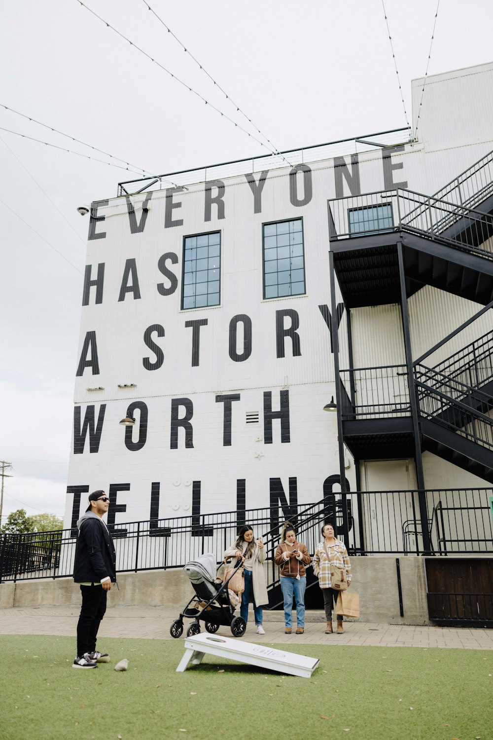 a group of people standing in front of a building