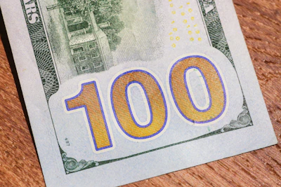 Close-up of a golden check with $35,000,000 written on it.