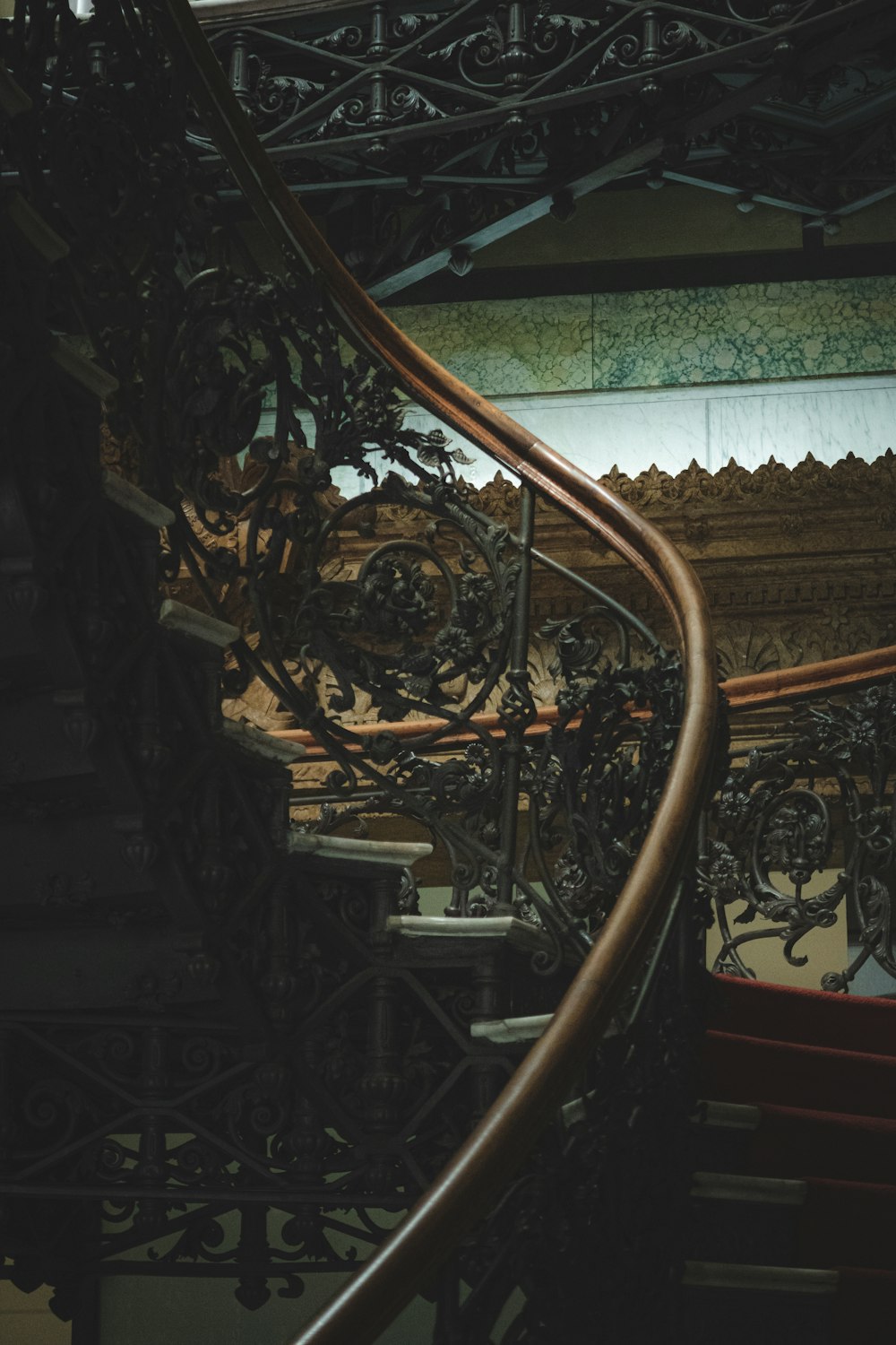 a spiral staircase in a building with a clock on it