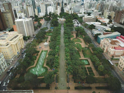 Aerial view of a lush urban park integrated with city buildings