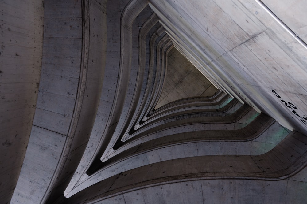 a close up of a very tall building with a clock on it's side