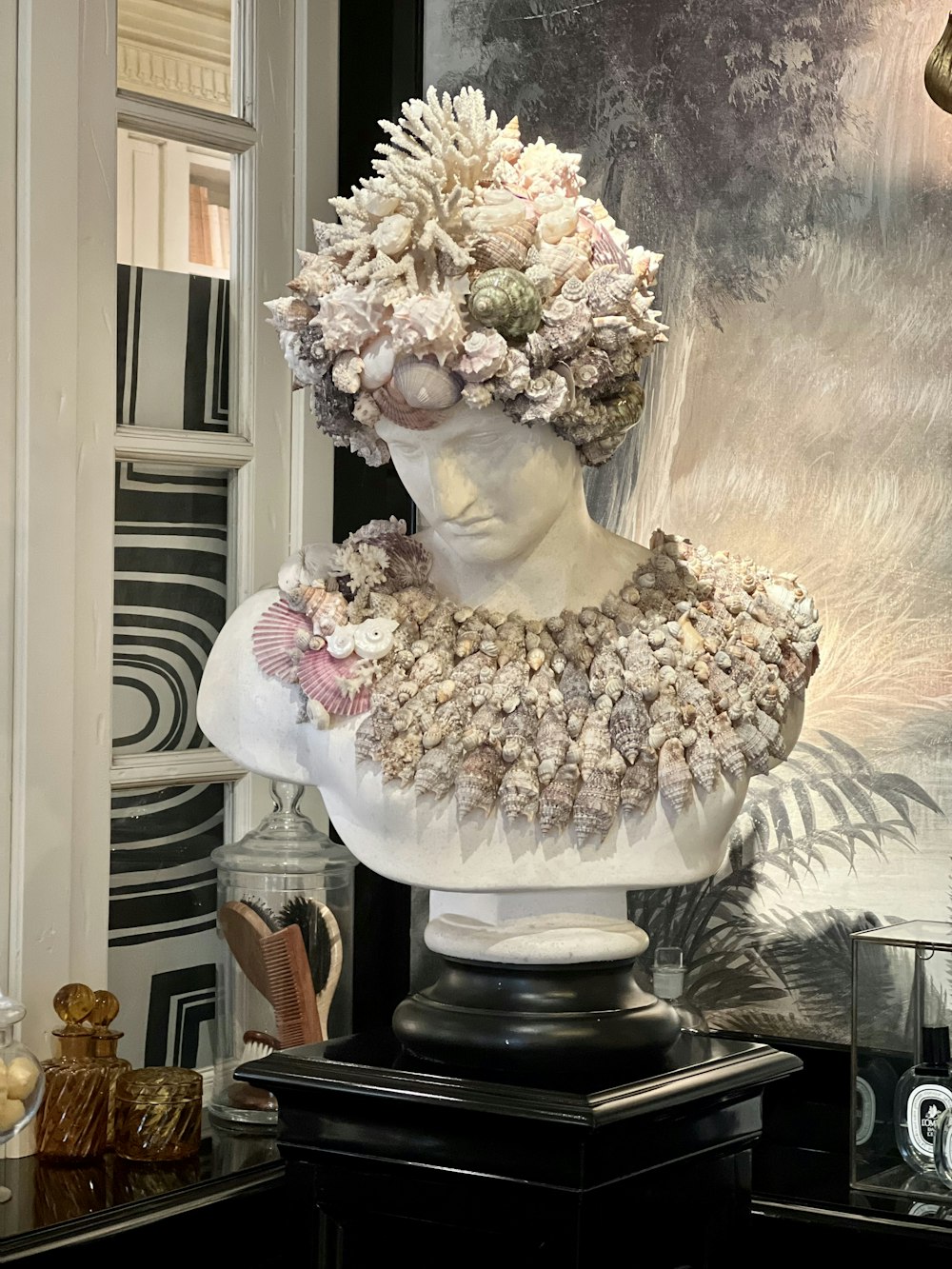 a bust of a woman with flowers in her hair