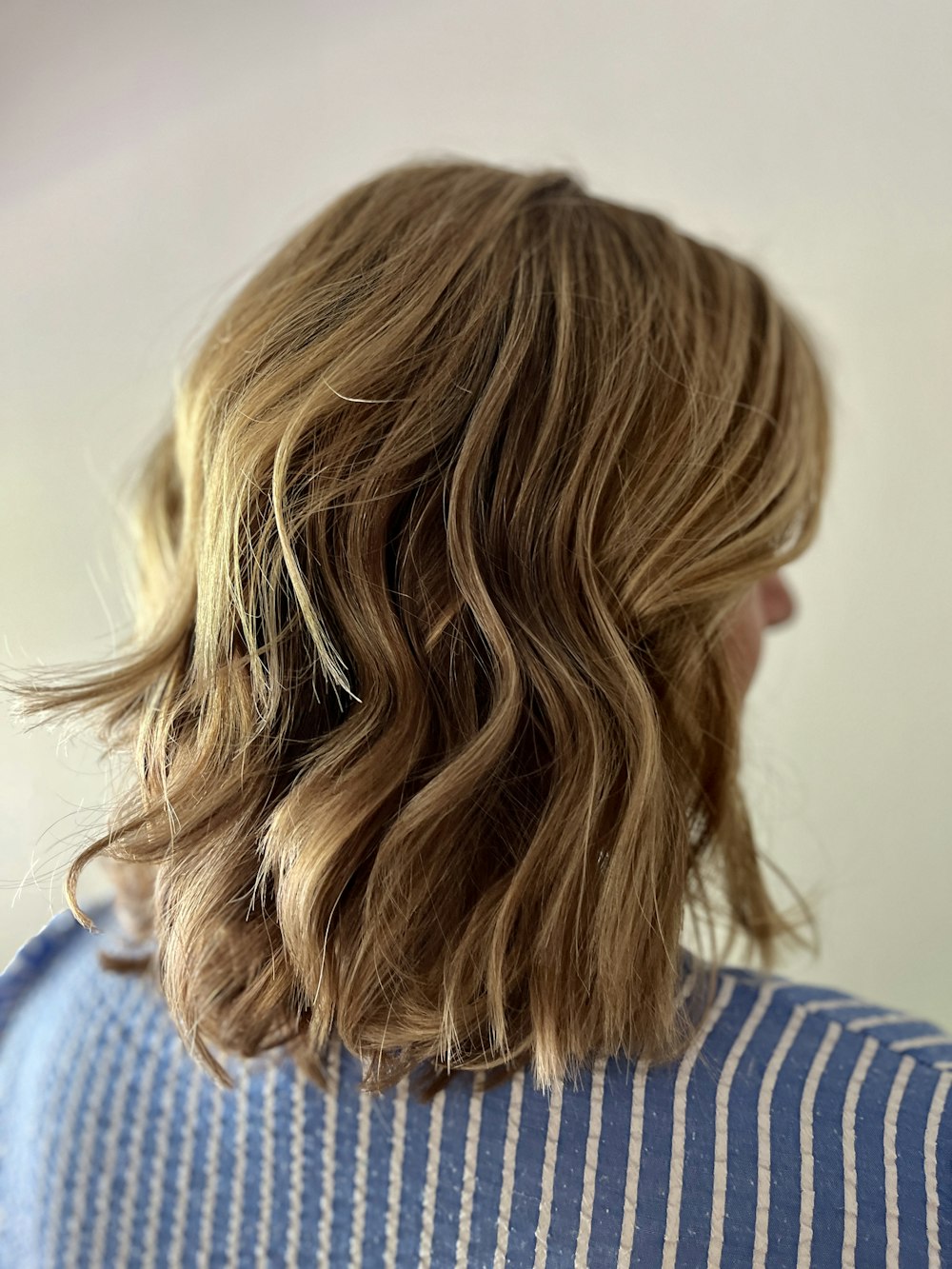 a close up of a person with wavy hair