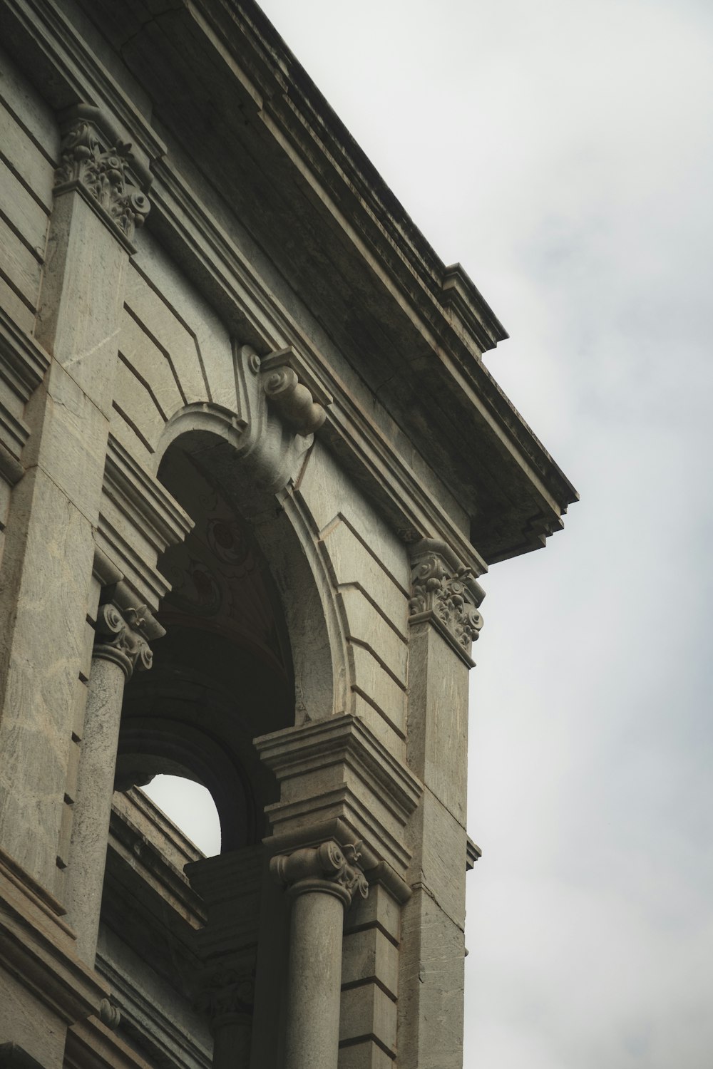 an old building with a clock on the front of it