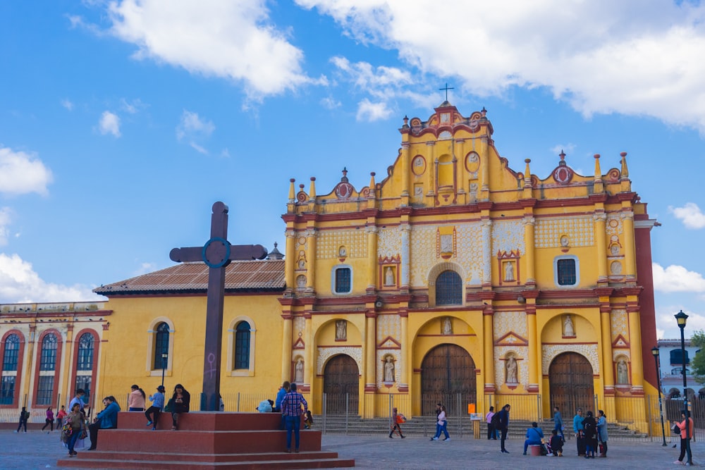 a group of people standing in front of a church