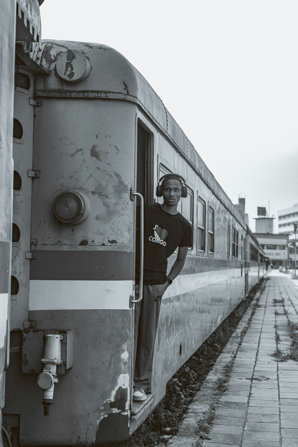 a man standing in the doorway of a train