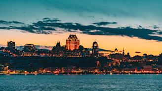 A cinematic shot of a city skyline at dusk with warm lighting