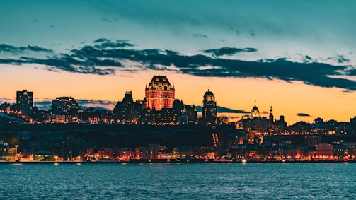 The Philadelphia skyline at dusk, illuminated with warm lights symbolizing hope and renewal.