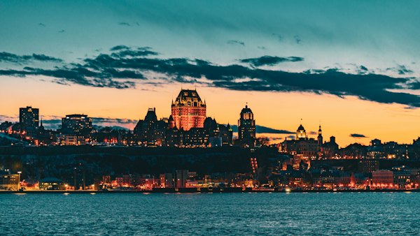 A view of a city at night from across the water — Quebec City, Canada