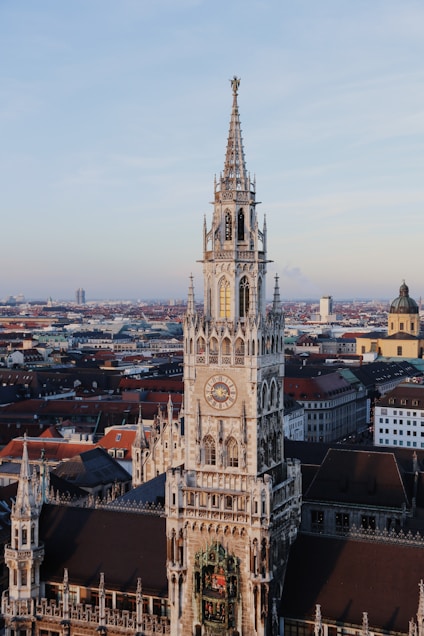 a large clock tower towering over a city