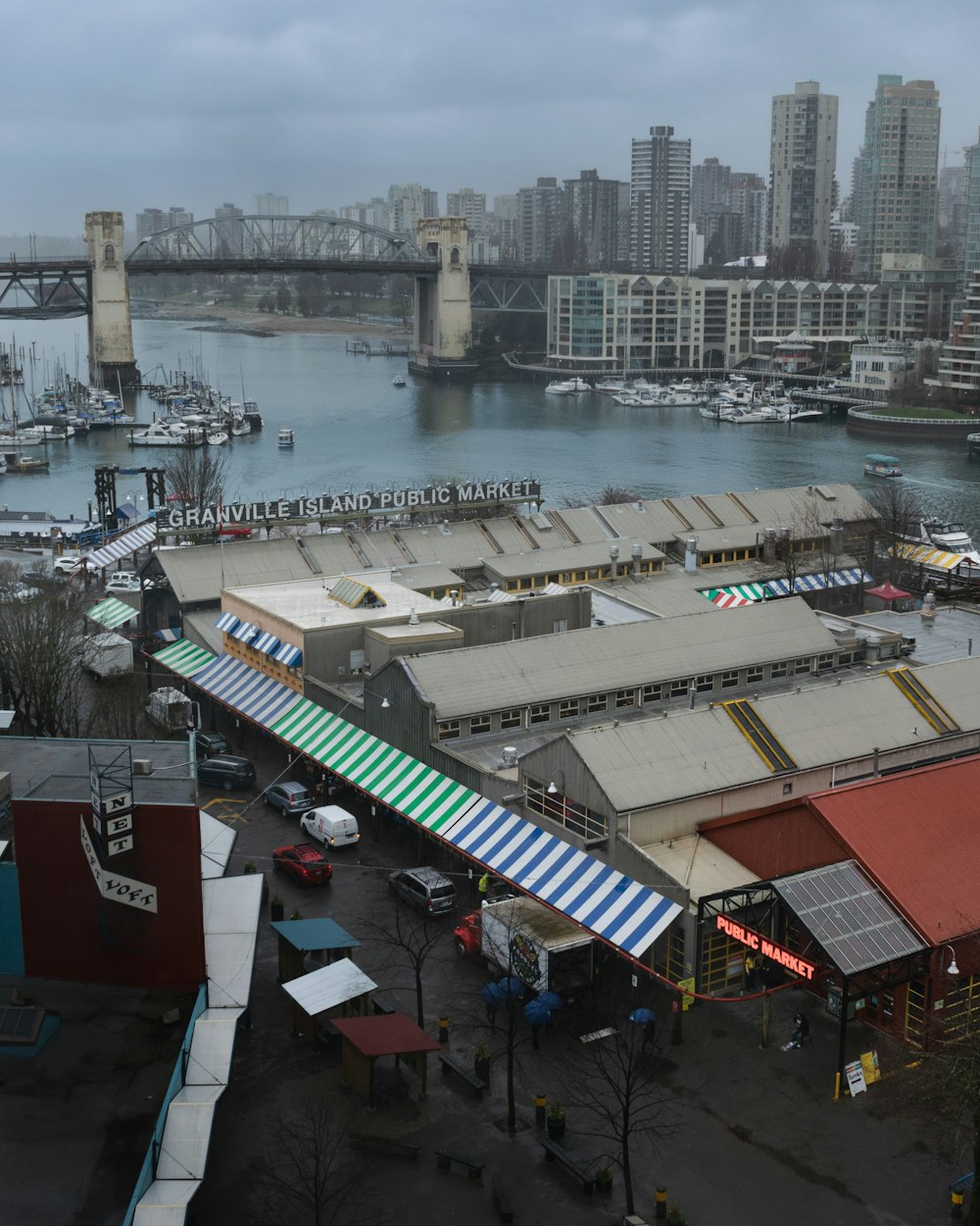 a view of a harbor with a bridge in the background