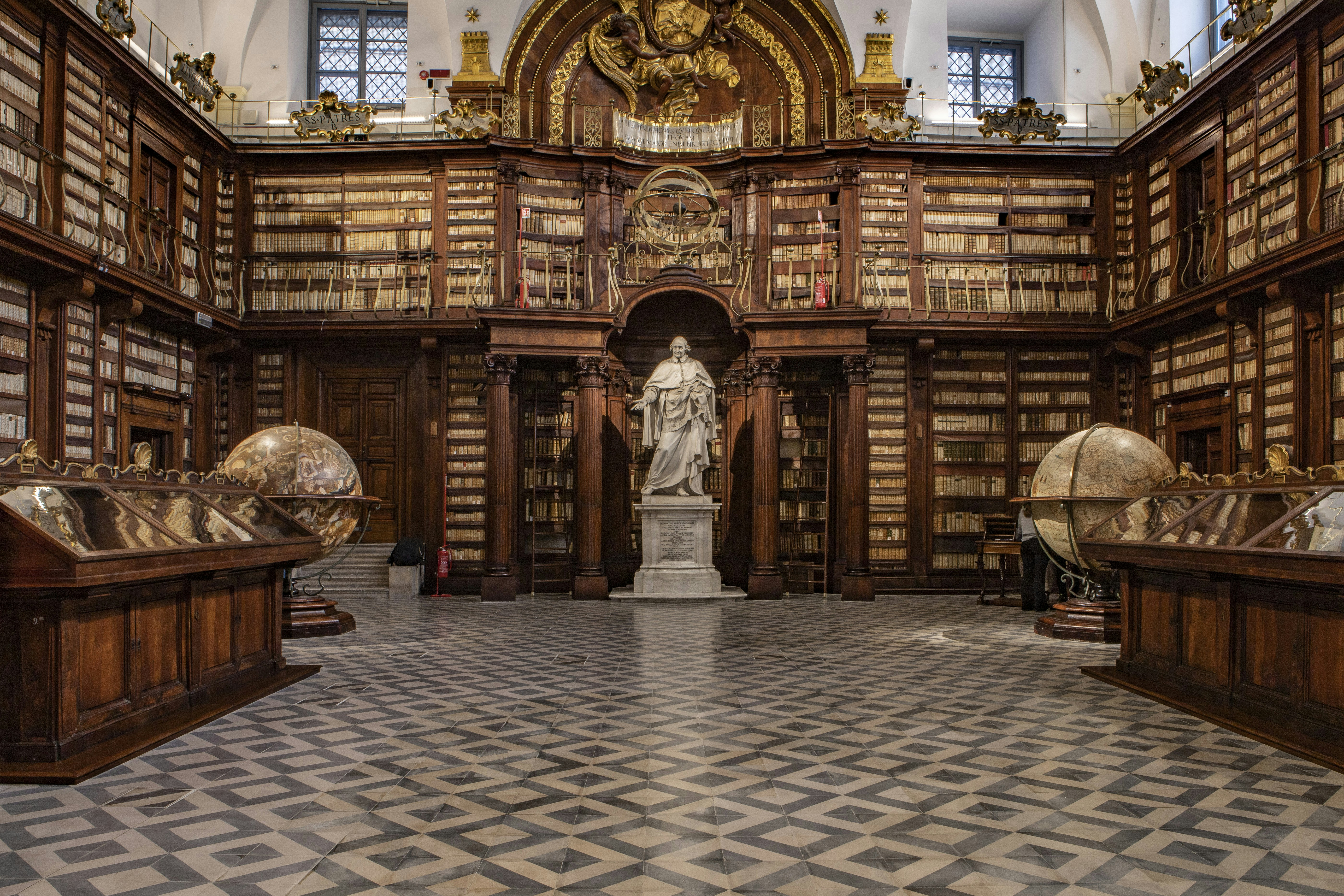 Vintage typewriter with classical books in atmospheric lighting