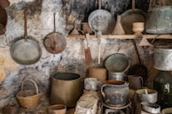 A rustic kitchen scene with cooking utensils and spices.