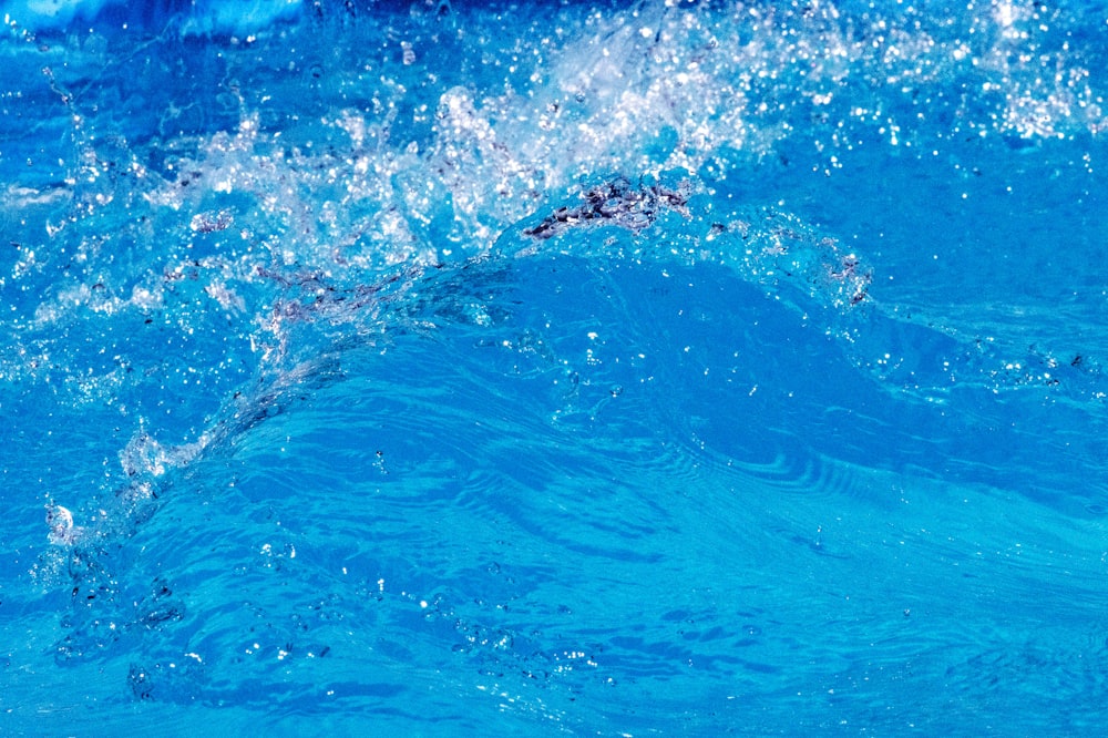 a person riding a surfboard on a wave in the ocean