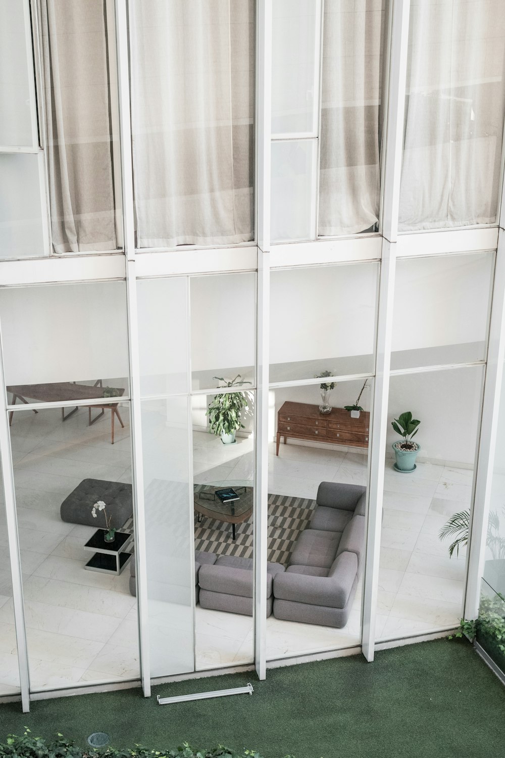 a living room filled with furniture and a large window