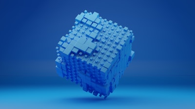 a blue cube shaped object on a blue background