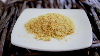 a white plate topped with a pile of food