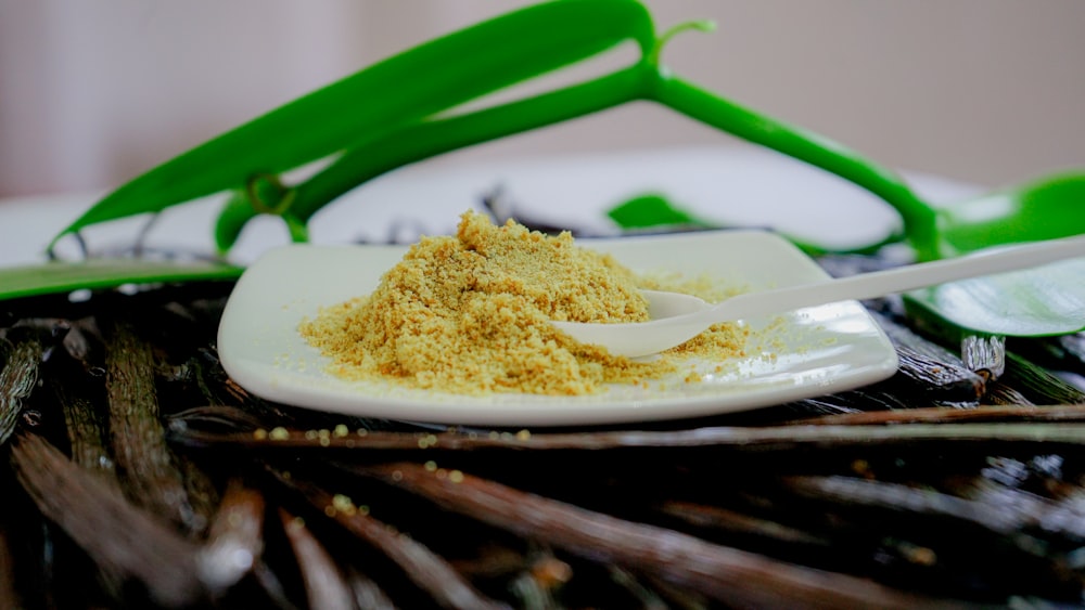 a white plate topped with a scoop of powder