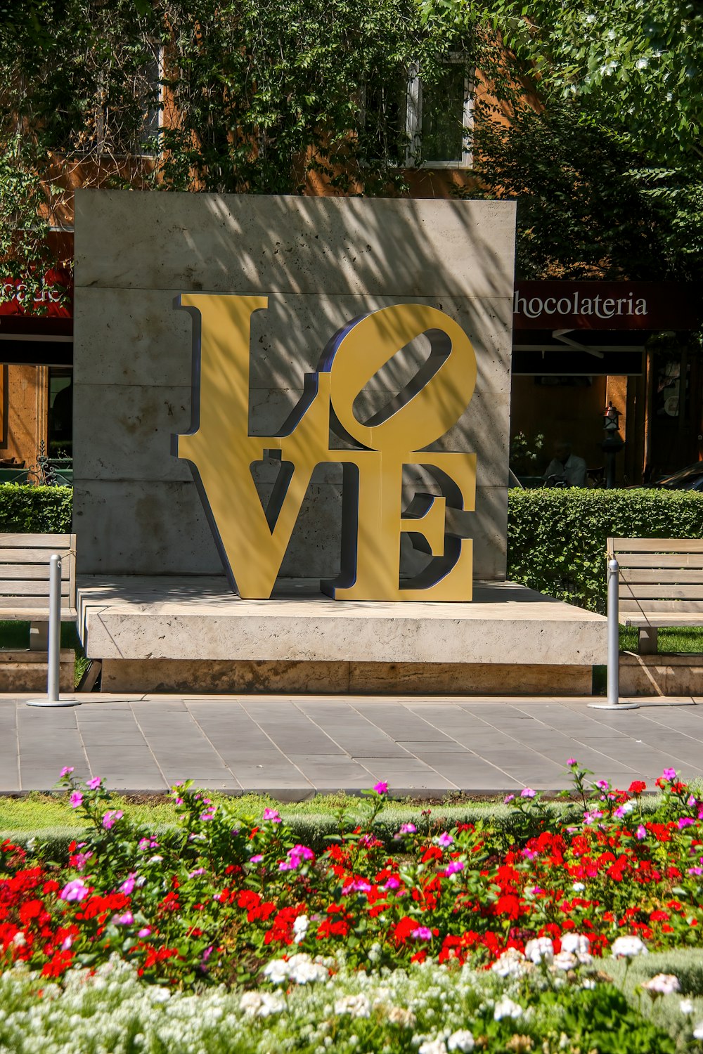 a sign that says love in front of a building