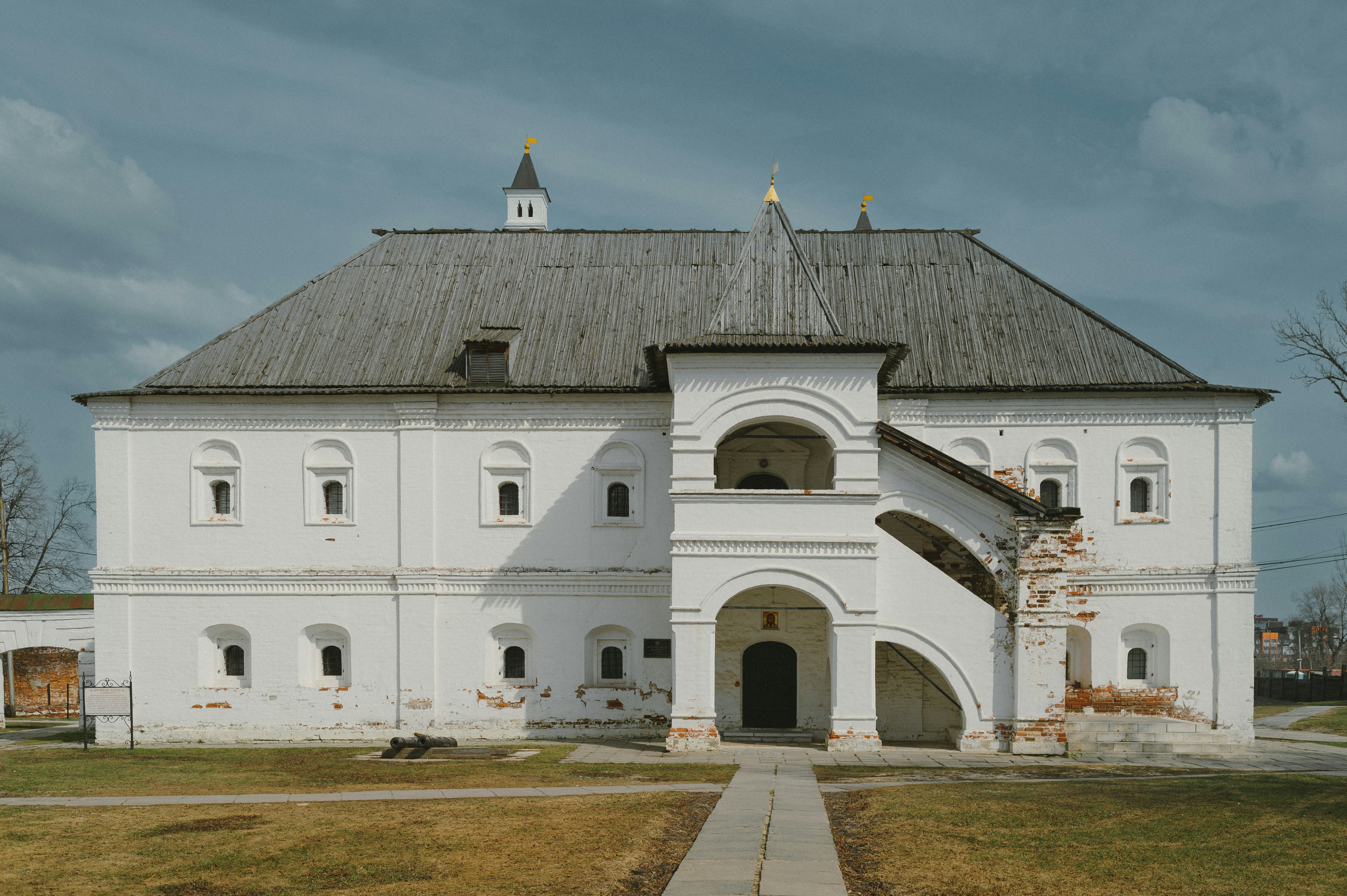 a large white building with a clock tower on top of it
