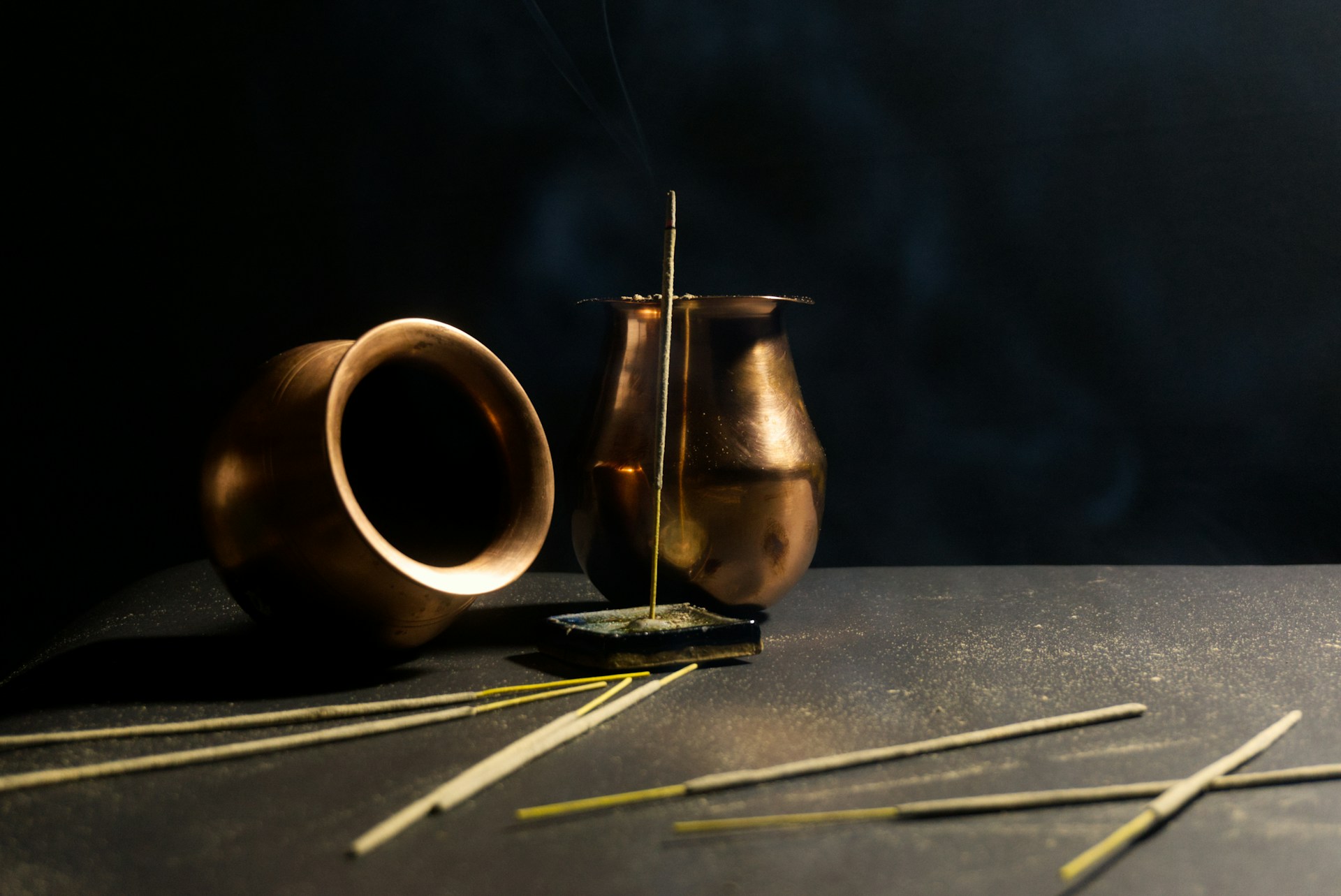 a couple of vases sitting on top of a table