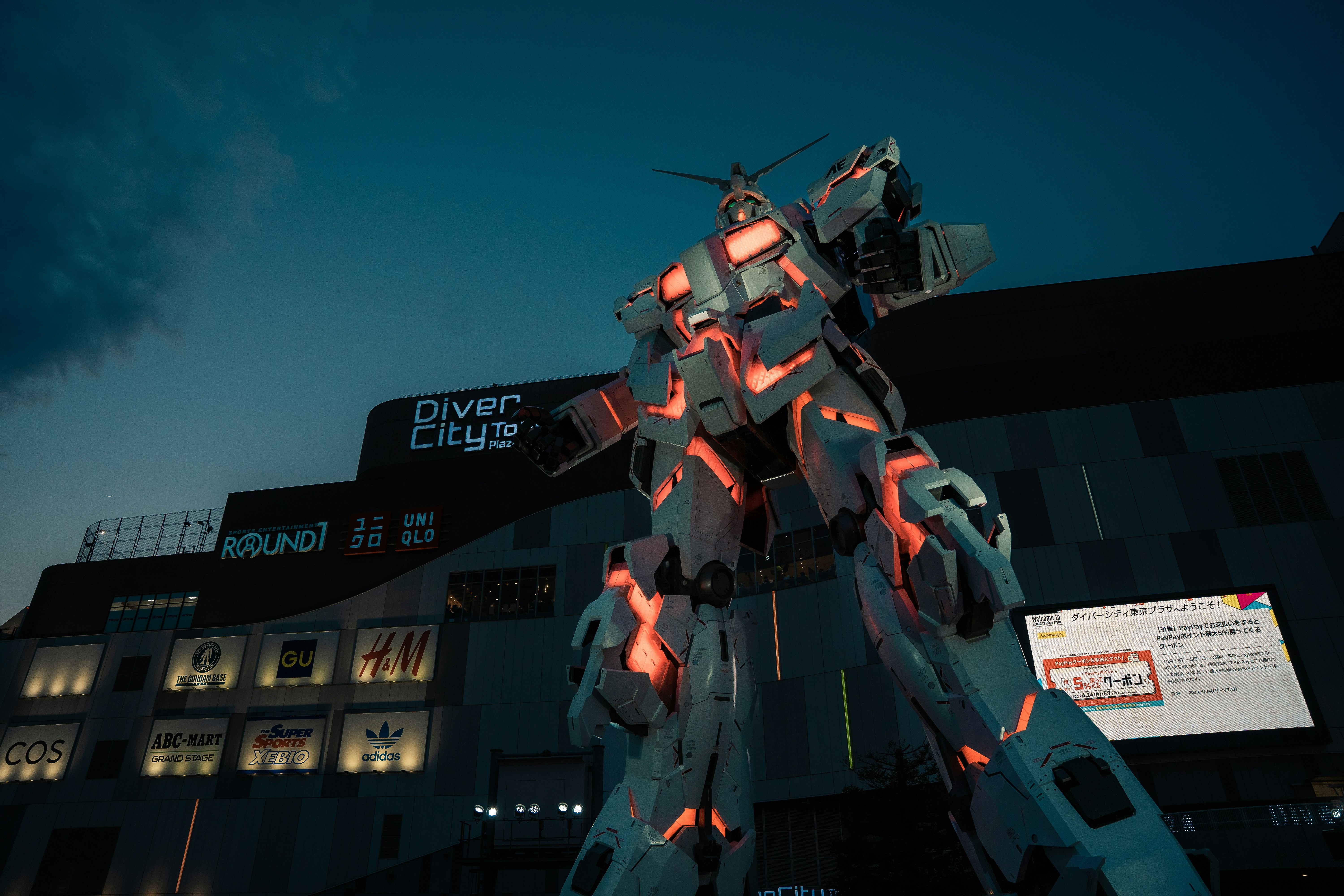 a giant robot standing in front of a building