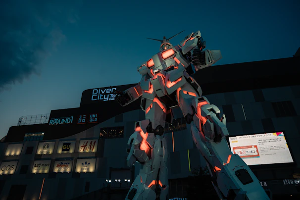 Modern LED touch totem standing tall near a shopping mall entrance with colorful ads
