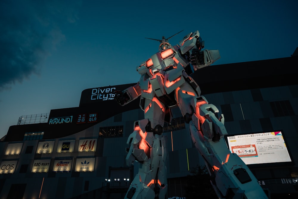 a giant robot standing in front of a building