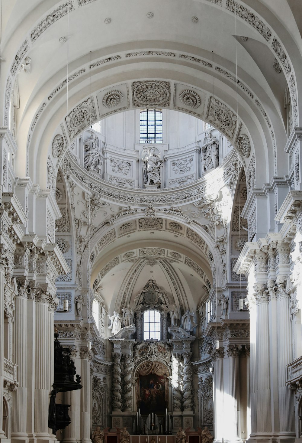 a church with a very tall ceiling and many pillars