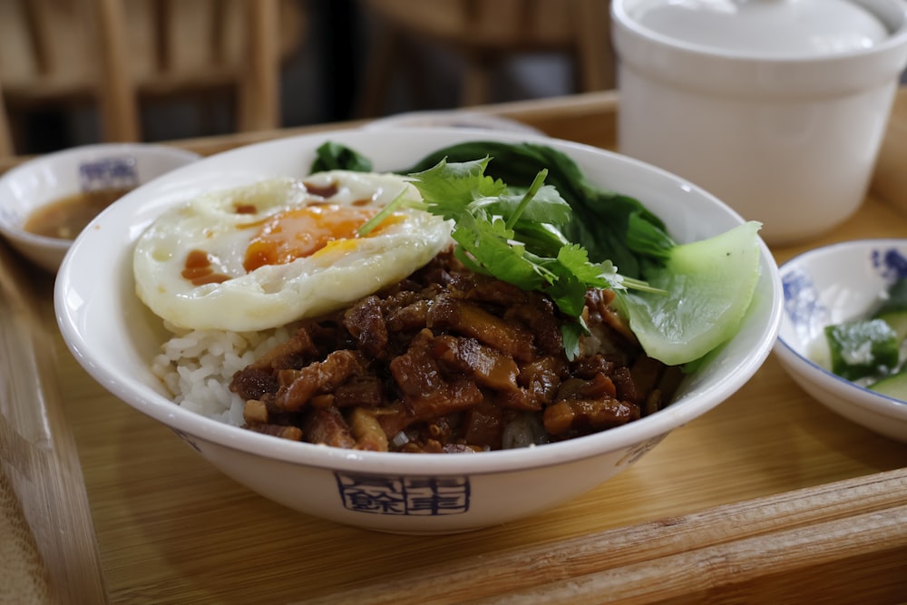 a close up of a bowl of food on a table