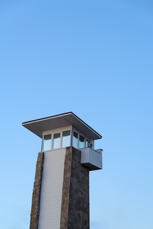 The iconic Markka Watch Tower standing tall with clear blue skies behind.