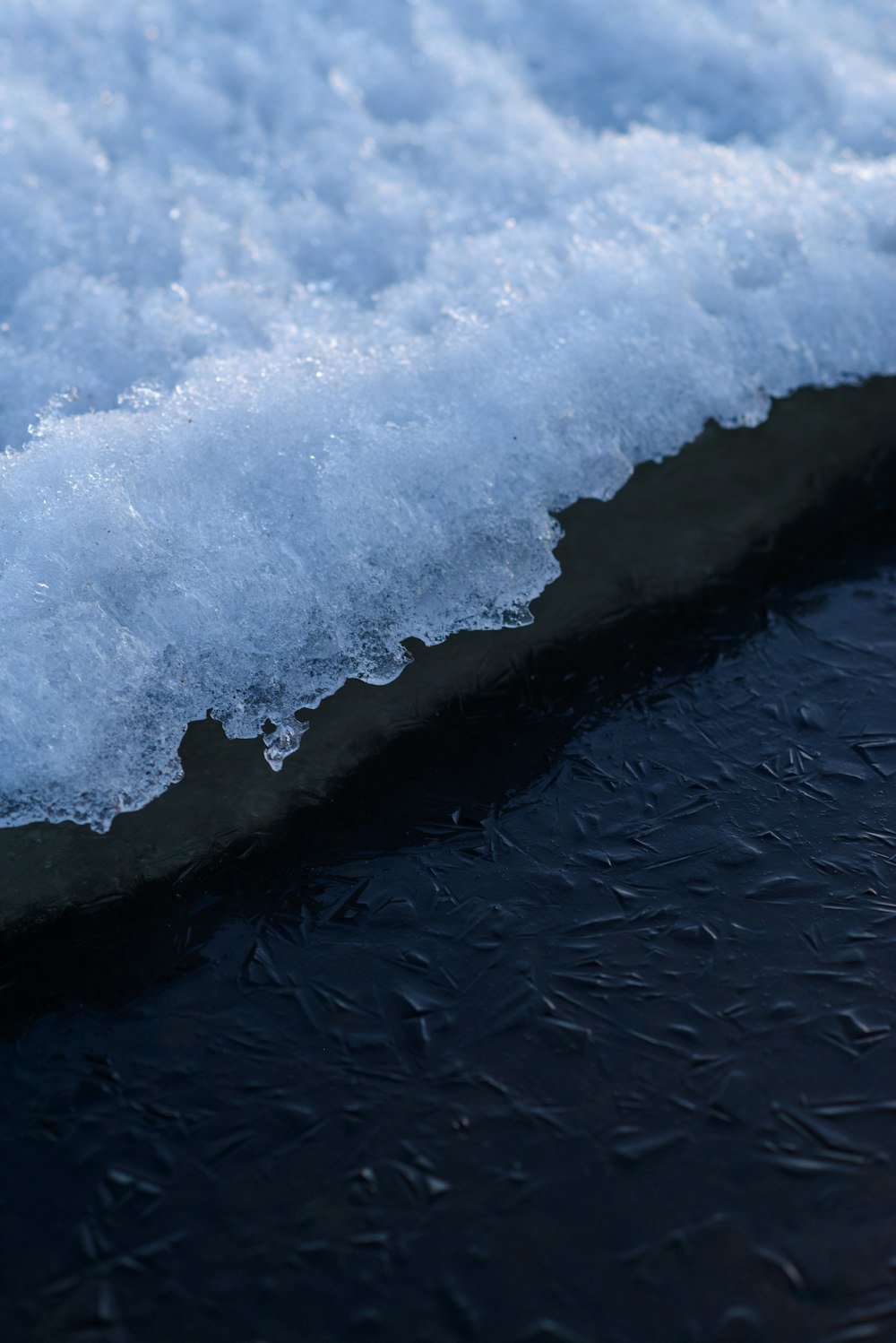 a close up of a piece of ice on water