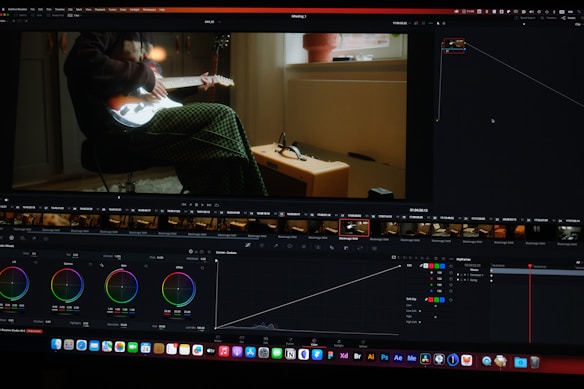 a computer screen showing a man sitting in a chair