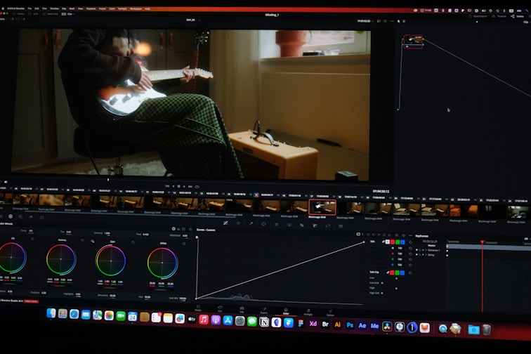 a computer screen showing a man sitting in a chair