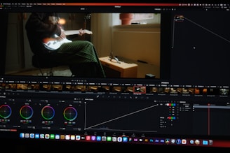 a computer screen showing a man sitting in a chair