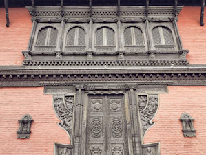 Volunteers carefully restoring the intricate woodwork of a historic South Flower Street home.