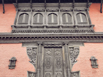 Volunteers carefully restoring the intricate woodwork of a historic South Flower Street home.