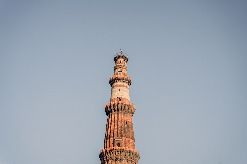 a tall tower with a clock on the top of it