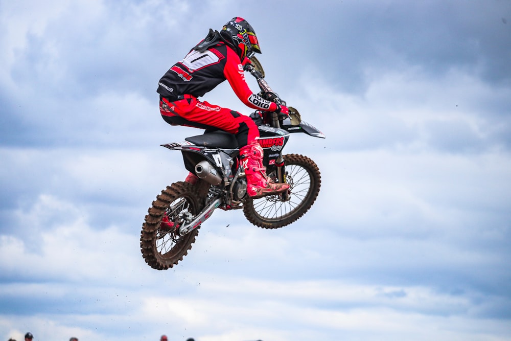 a person on a dirt bike in the air