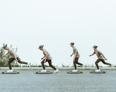 a man riding a longboard skateboard down a street