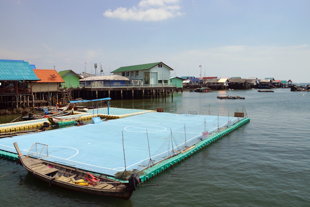 a basketball court in the middle of a body of water