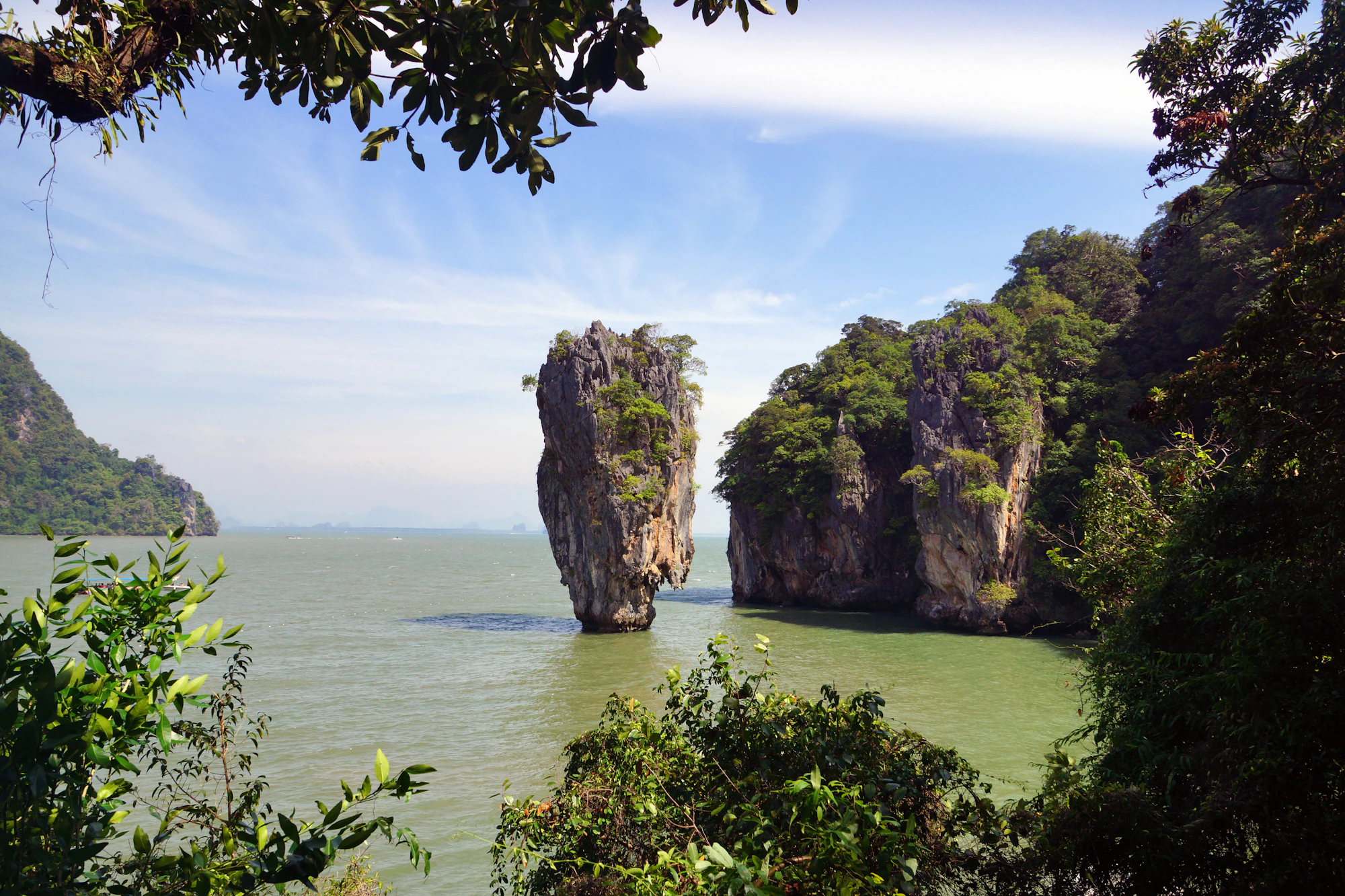 Limestone karst rising from the calm water of Phang Nga Bay, the bay Koh Yao Noi sits in