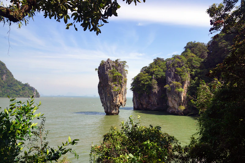 Limestone karst rising from the calm water of Phang Nga Bay, the bay Koh Yao Noi sits in