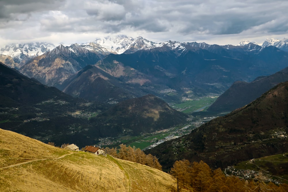 a view of a valley with mountains in the background