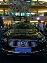 A lineup of various Volvo models displayed elegantly in a modern showroom.