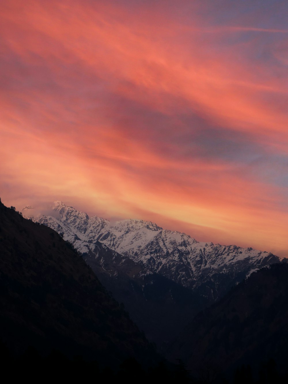 a view of a mountain range at sunset