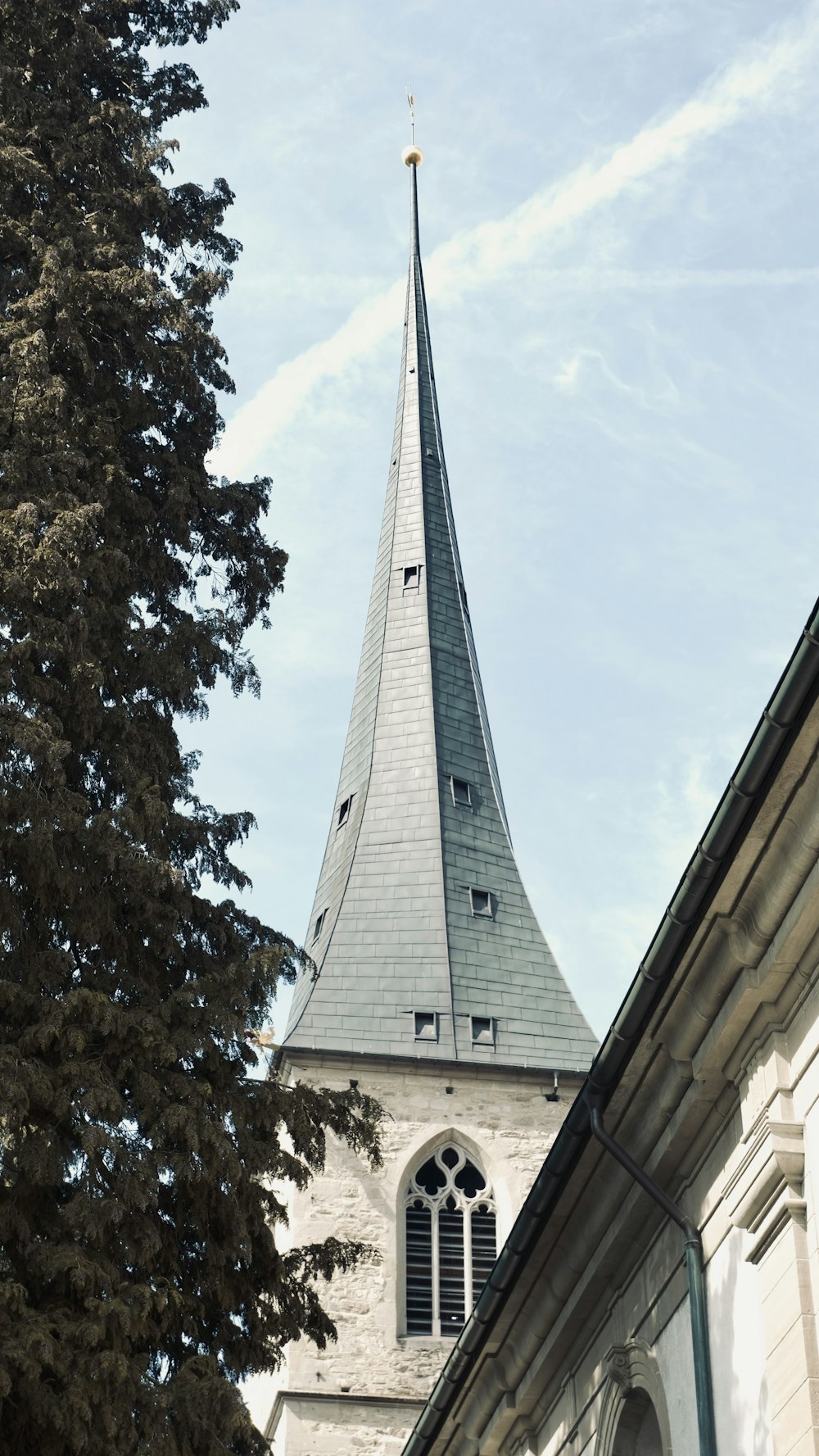 a steeple of a church with a clock on it